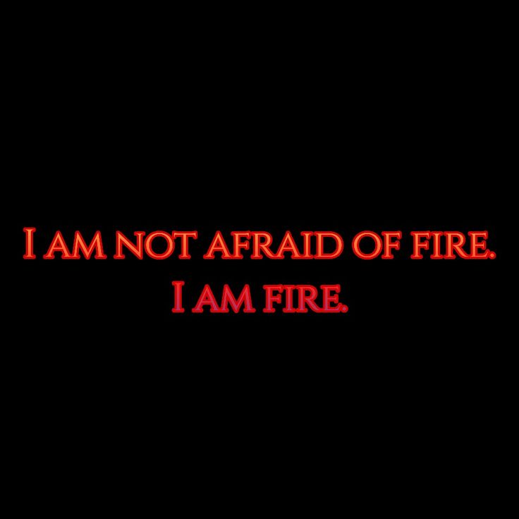 the words i am not afraid of fire on a black background with red text below