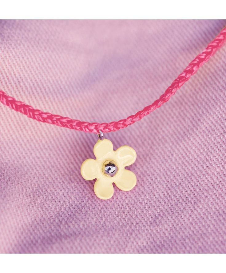 Greet summer in style with our Solstice Enamel Flower Charm Bracelet. In two string shades— pink and seafoam green—this bitty braid design features an enameled flower charm with a silver ball bead in the middle. Pink Adjustable Flower Shaped Necklace, Adjustable Pink Flower-shaped Necklace, Pink Adjustable Necklace For Friendship, Trendy Summer Jewelry With Flower Decoration, Trendy Summer Flower Decorated Jewelry, Adjustable Flower Decorated Jewelry For Spring, Summer Flower Charm Jewelry, Adjustable Flower Pendant Necklace For Spring, Adjustable Flower Shaped Necklace For Spring