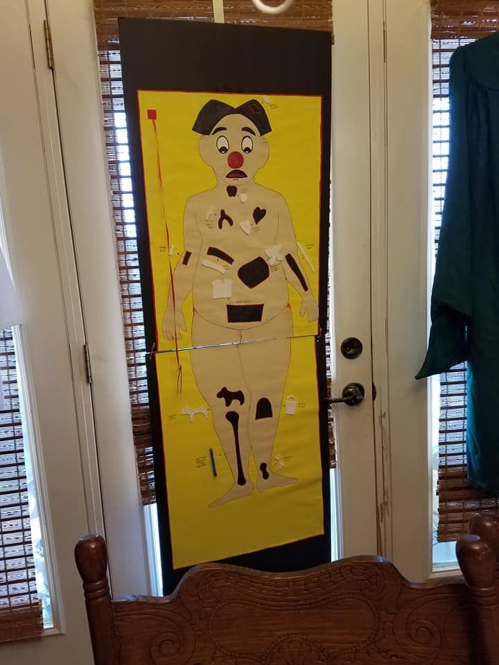 the door is decorated with an image of a woman's body and legs on yellow paper