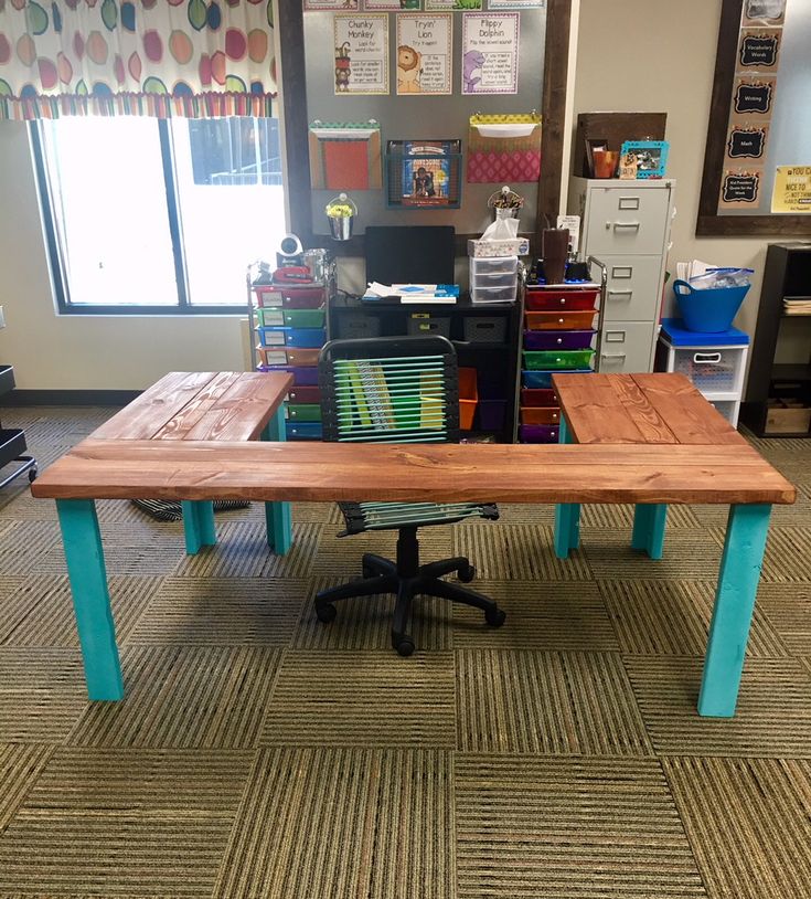 a wooden table sitting on top of a carpeted floor