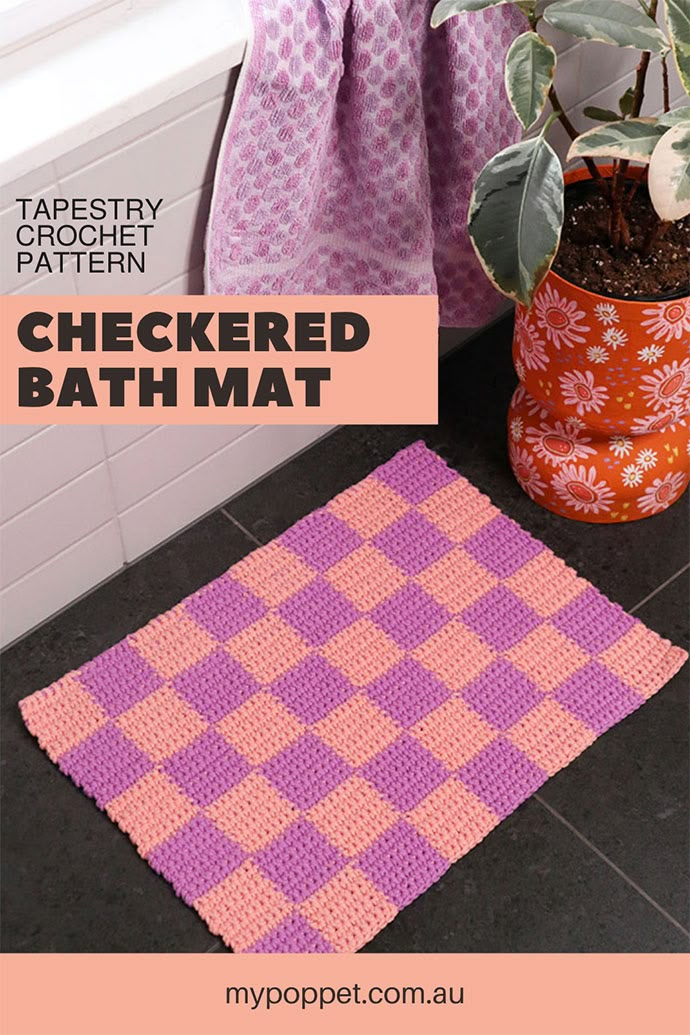 a bath mat that has been crocheted and is next to a potted plant