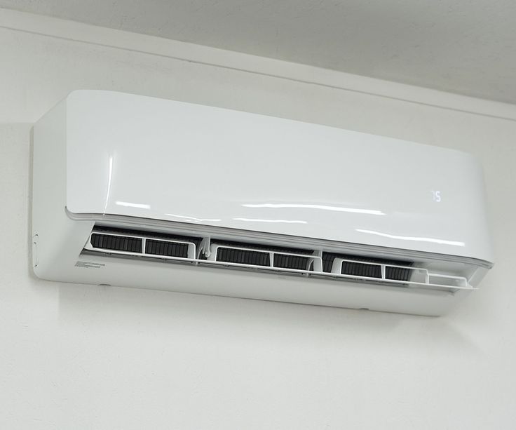 a white air conditioner mounted on the wall