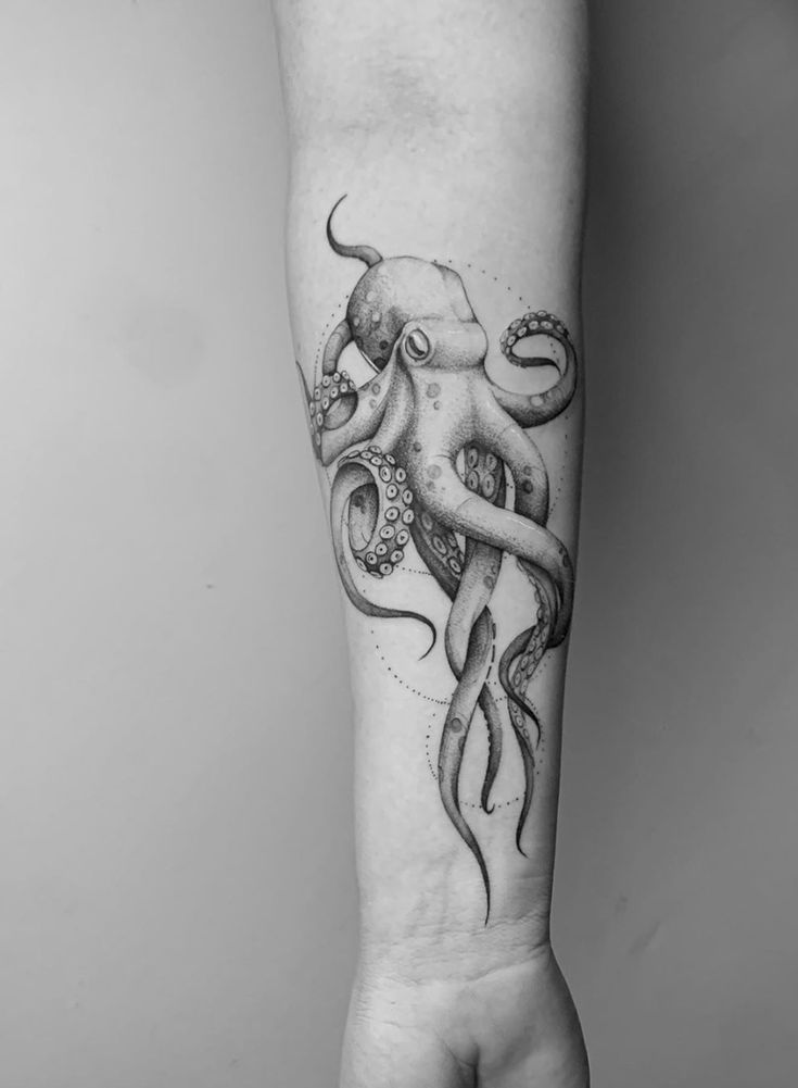 an octopus tattoo on the arm