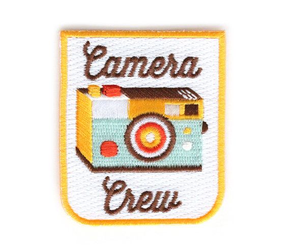 an embroidered badge with the words camera crew on it's front and back side