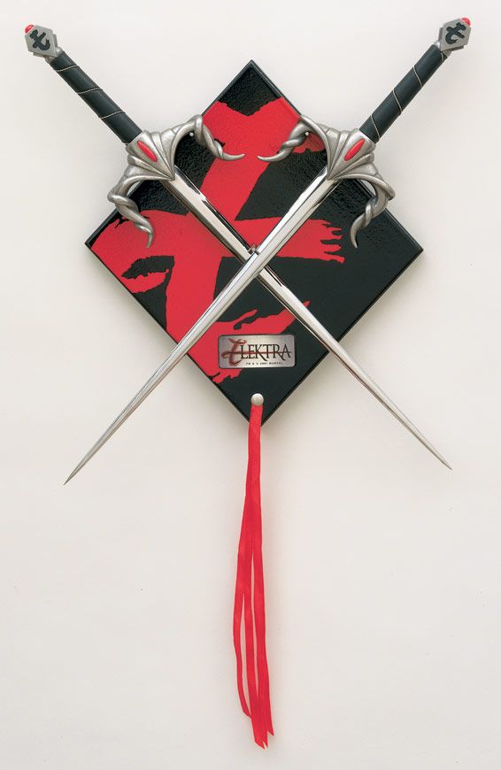 two swords with red and black designs on them