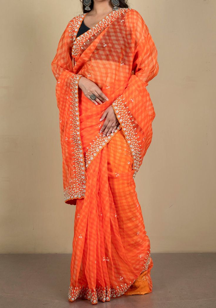 This Handloom Soft Organza Zardosi Silk Saree is a perfect and unique choice for your occasional and party wear.Latest Bollywood Inspired Handloom Soft Organza Katdana Work Zardozi Silk Saree This saree is meticulously crafted from the finest woven fabrics and embellished with intricate handcrafted Katdana work for a stunning look. With an eye-catching design, you'll be sure to stand out from the crowd. Soft Organza Silk Saree. Banaras Weaving Cluster Katdana, Stone and Zardozi Work. Unstitched Festive Tissue Silk Sharara With Cutdana, Georgette Sharara With Cutdana In Orange, Orange Georgette Sharara With Cutdana, Tissue Silk Sharara With Cutdana For Diwali, Orange Cutdana Sharara With Traditional Drape, Bollywood Style Art Silk Pre-draped Saree With Sheer Dupatta, Orange Sharara With Cutdana For Diwali, Orange Cutdana Sharara For Diwali, Chanderi Cutdana Pre-draped Saree