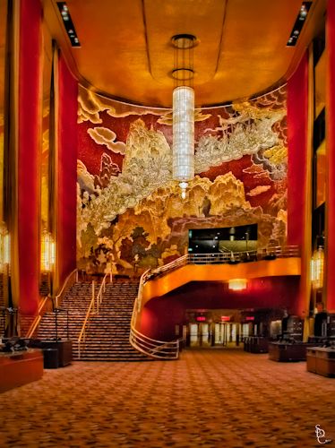 the interior of a building with red and gold walls