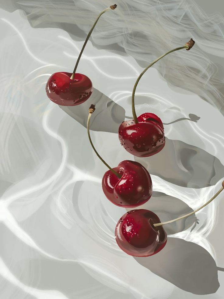 three cherries are sitting on top of each other