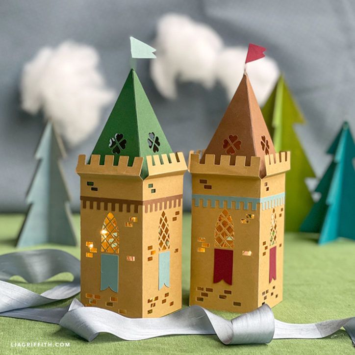 two paper castles sitting on top of a table