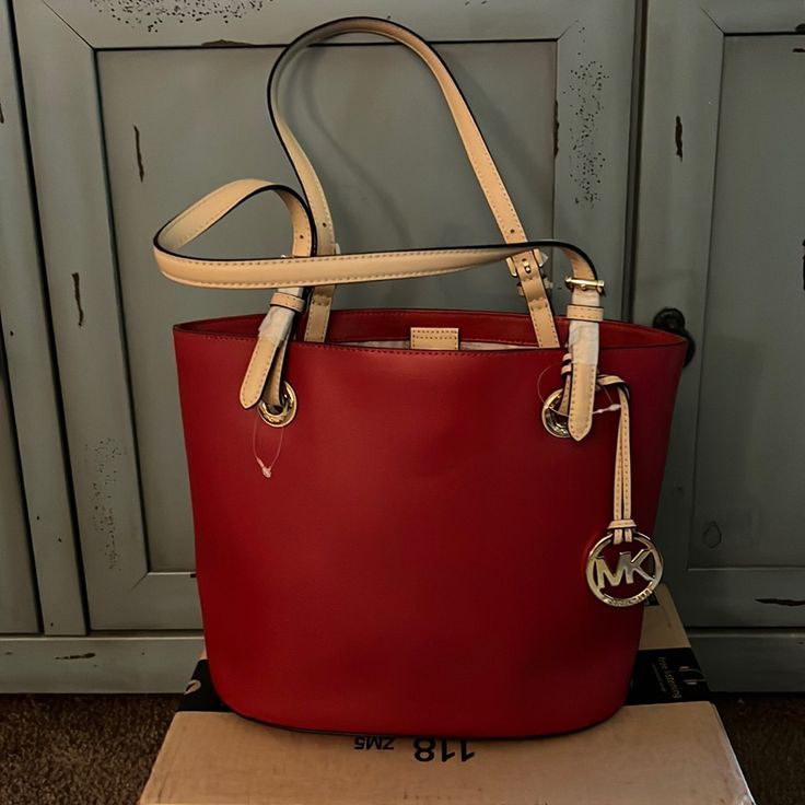 Beautiful Red Leather With Tan Adjustable Straps. This Bag Is New With Tags! I Have Quite A Collection Of Purses And I Just Had To Have This Bag But It’s Just Been Sitting In My Closet. This Bag Is Large Enough To Carry All Of Your Necessities And Then Some. Red Leather Lined Shoulder Bag, Red Leather Bag With Gold-tone Hardware, Red Leather Shoulder Bag With Gold-tone Hardware, Designer Red Shoulder Bag In Soft Leather, Designer Red Soft Leather Shoulder Bag, Designer Red Shoulder Bag, Designer Red Leather Shoulder Bag, Red Leather-lined Bags For Shopping, Red Leather Bags For Errands