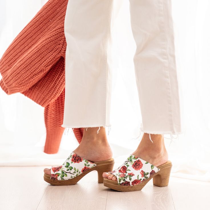 A romantic take on our open-toe mule clog. The textured white leather upper is embossed with a gorgeous floral motif. Handcrafted in Italy from premium leather, the Frida clog features a cushioned sole that flexes as you walk for all-day comfort. Pair with a floaty dress or wide-leg jeans for a dreamy look. Flexible sole with wood-like effect Heel 7,5 cm / 2.95 Inches Handmade in Italy Spring Clogs With Padded Open Heel, Spring Clogs With Padded And Open Heel, Spring Clogs With Padded Heel And Open Back, Spring Clogs With Padded Heel And Open Heel, White Open Heel Mules With Cushioned Footbed, White Mules With Cushioned Footbed And Open Heel, White Cushioned Open Heel Mules, White Open Toe Clogs With Cushioned Footbed, Spring Slip-on Clogs With Padded Heel