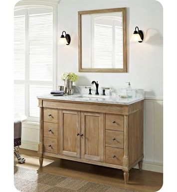 a bathroom vanity with two sinks and mirrors