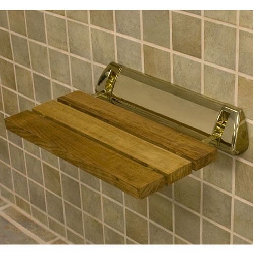 a wooden shelf mounted to the side of a tiled wall