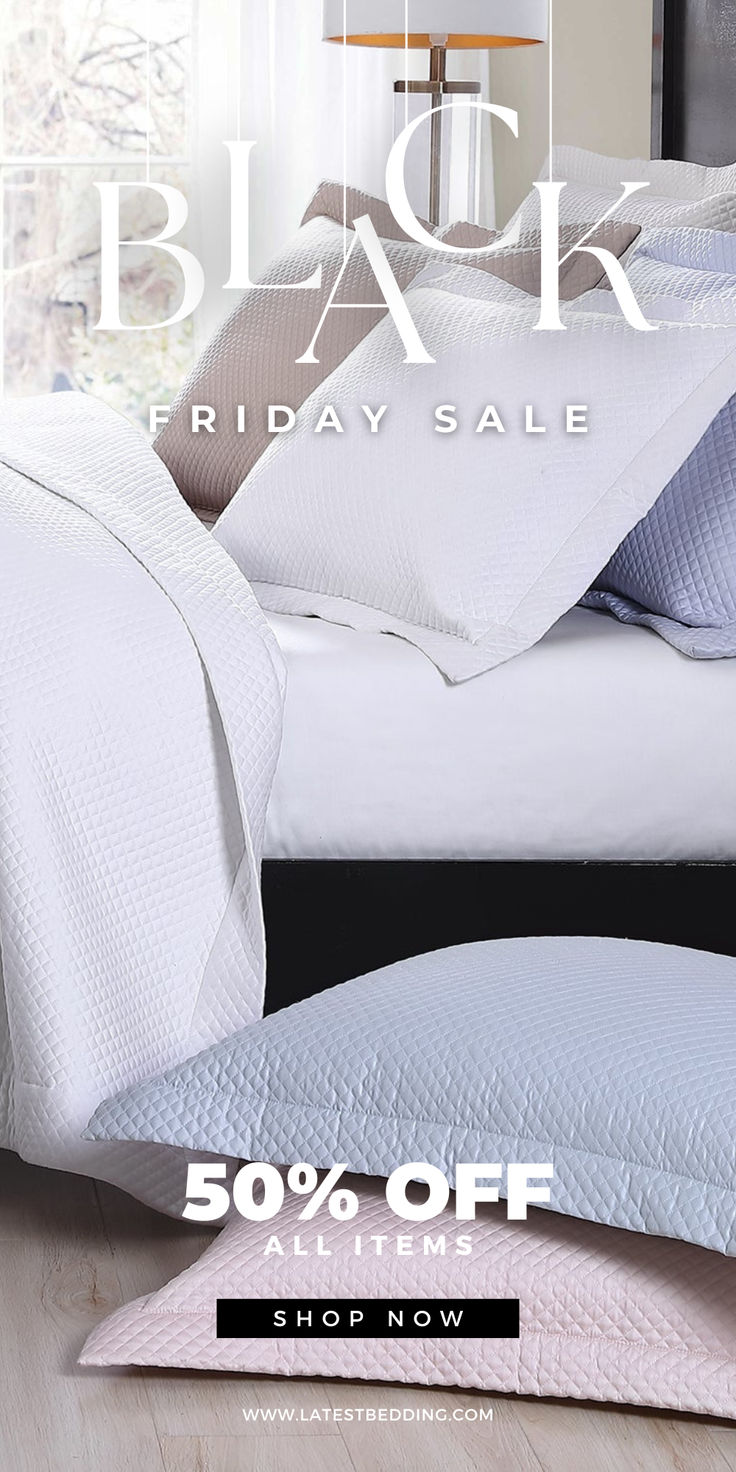 a bed with white sheets and pillows on it in front of a black friday sale sign