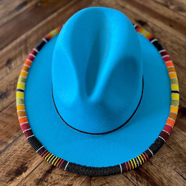 This Is A Beautiful One Of A Kind Hand Beaded, Original Designed Southwest Hat. Beautiful Turquoise Hat With Red Underlay.Over 2000 Beads Hand Sewn.One Size Fits All Has Drawstring On Inner Lining To Fit Any Size Head Made Of Cotton And Polyester. [Built-In Adjustable Strap] The Circumference Of The Wide Brim Fedora Hat: 56-58cm/22"-22.8", The Brim Width: 7.5 Cm/2.95 ".Has An Adjustable Drawstring Inside, Suitable For Most Men And Women , You Can Adjust It According To Your Own Size To Meet Your Handmade Blue Hat Bands With Curved Brim, Blue Beaded Hat Bands For Festival, Traditional Fitted Blue Hat, Adjustable Beaded Blue Hat, Adjustable Blue Beaded Hat, Traditional Blue Hat With Curved Brim, Bohemian Blue Beaded Hat, Blue Bohemian Beaded Hat, Traditional Blue Hat For Festival