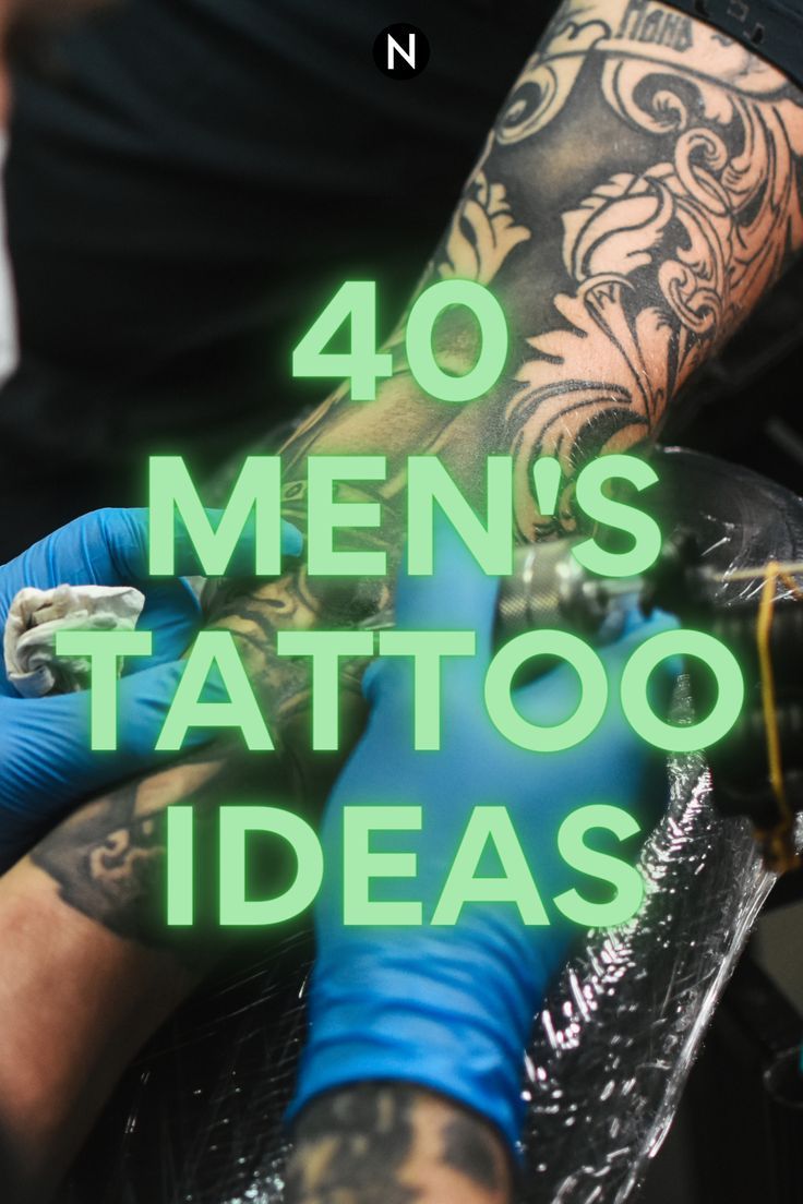 a man with tattoos on his arm getting ink done