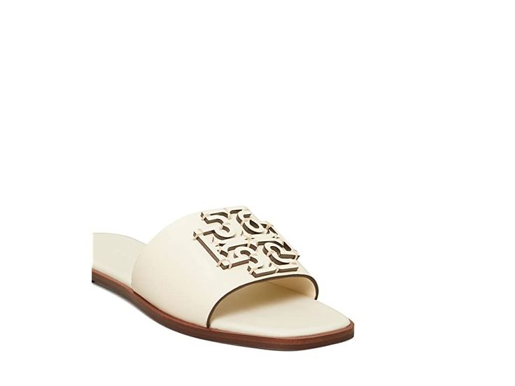 Tory Burch Ines Slide - Women's Slide Shoes : New Ivory : Add a charming touch to your look with the clean and chic Tory Burch Ines Slides. Upper made of leather with logo detail. Easy slip-on design. Leather lining. Lightly cushioned, stationed insole. Round toe. Synthetic sole. Made in Brazil. Measurements: Heel Height: 1 4 in Weight: 6 oz Product measurements were taken using size 9, width M. Please note that measurements may vary by size. Weight of footwear is based on a single item, not a p Open Toe Sandals With Logo For Spring, Spring Open Toe Sandals With Logo, Spring Season Open Toe Sandals With Logo, Leather Open Toe Sandals With Logo, Classic White Sandals With Leather Sole, Elegant Slides With Cushioned Footbed And Round Toe, Chic Summer Sandals With Logo, Chic Logo Sandals For Summer, Elegant White Leather Slides