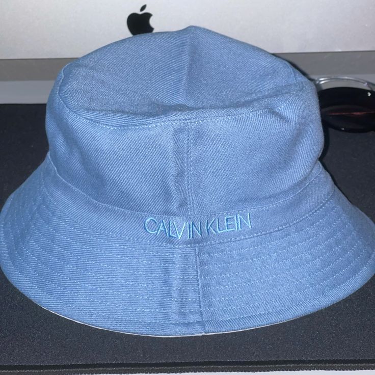 Nwt! ******Only Have The Blue Left****** Quantity: 1 White, 1 Blue Logo At The Crown $55 Each Tailing The Resurgence Of ‘90s Styling This Season Is The Return Of The Bucket Hat, With Calvin Klein Delivering A Refined (Solid Side) 80% Rayon, 20% Linen (Print Side) 100% Polyester Hand Wash Cold Only Before You Place An Order With Me, Please Message Me To Let Me Know Which Color You Want **Please Look At The Pictures Closely And Make Sure It’s What You Want** All Sales Are Final! No Returns Thank Y Casual Blue Adjustable Bucket Hat, Blue Cotton Bucket Hat For Spring, Trendy Blue Flat Brim Bucket Hat, Blue Casual Bucket Hat For Spring, Spring Blue Cotton Bucket Hat, Casual Light Blue Wide Brim Hat, Blue Casual Bucket Hat With Curved Brim, Casual Blue Bucket Hat With Curved Brim, Everyday Blue Brimmed Hat