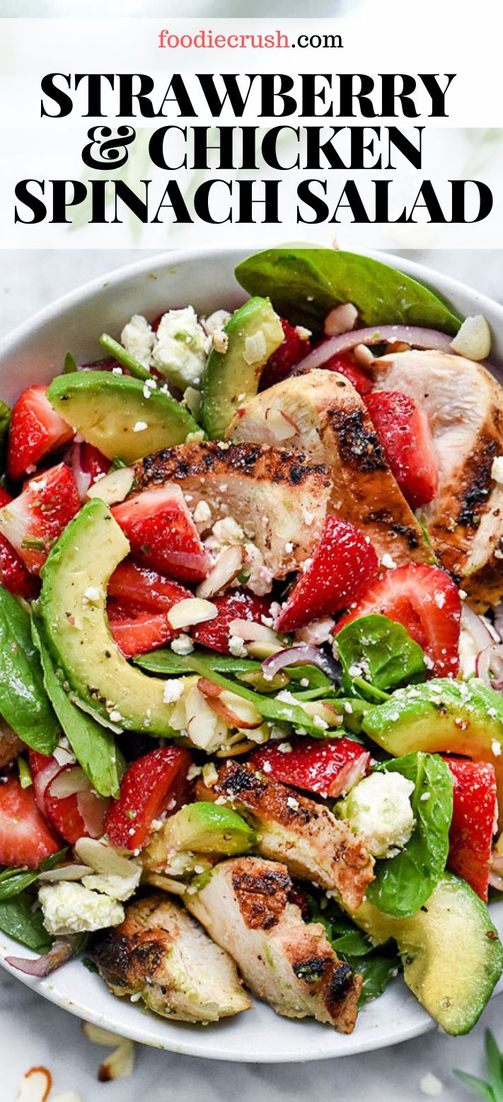 strawberry chicken and spinach salad on a white plate with the title text overlay