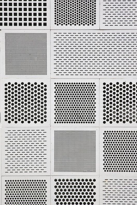 an array of black and white dots on a sheet of paper that has been cut into squares