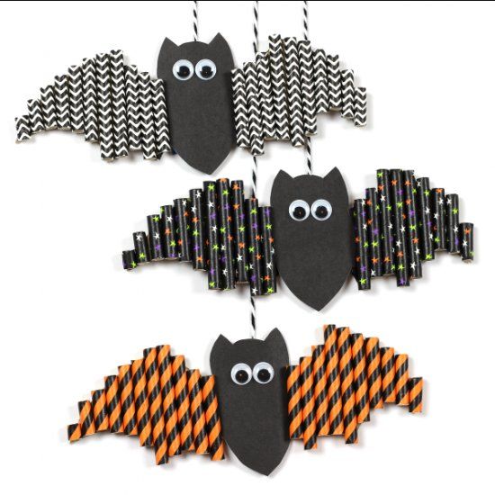 three halloween decorations with bats hanging from the top and one is made out of paper