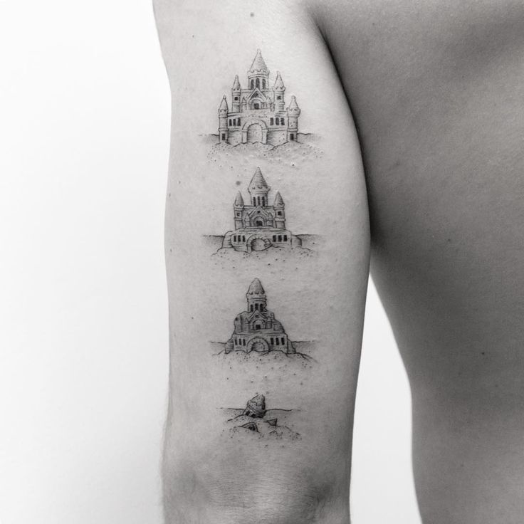 a woman's thigh with three different buildings on it