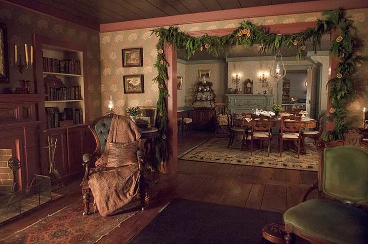 a living room filled with furniture and a fire place in the middle of a room