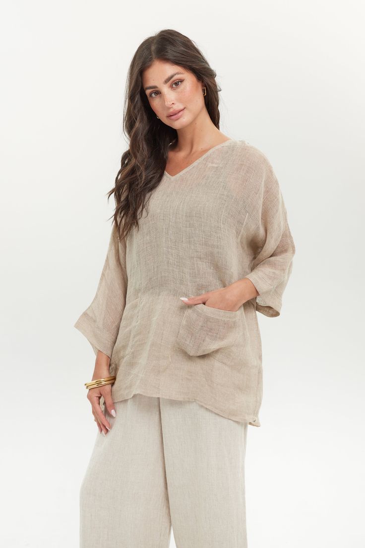 A casual linen basic to love and style in endless ways, maximizing your wardrobe. Loose and flowy with a pocket front detail, it's the perfect thing to wear on the weekend—hence its name! We designed this style to carry you from the beach to patio dinner or the farmers market beforehand. Get creative and style it as a classy, boho-chic look when the beach is far away. It will transport you! 100% European Linen, mesh linen 2-pocket front V Neckline Banded arm detail Layer over a camisole or wear Beige V-neck Top With Pockets, V-neck Tops With Pockets For Vacation, Beige Beach Tops With Pockets, Beach Beige Tops With Pockets, Relaxed Long Sleeve Tops With Pockets, Casual Neutral Linen Tops, Relaxed Beach Tops With Pockets, Relaxed Fit Lounge Blouse With Pockets, Casual V-neck Tops With Side Pockets