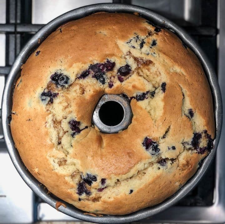 a blueberry bundt cake sitting on top of a stove