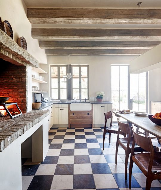 the kitchen is clean and ready to be used for cooking or baking, with an oven in the center