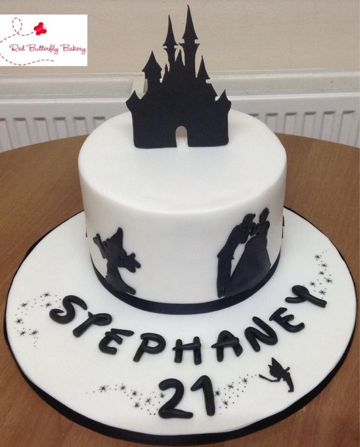 a white cake with black lettering and a castle on top that says stephanie 21st birthday