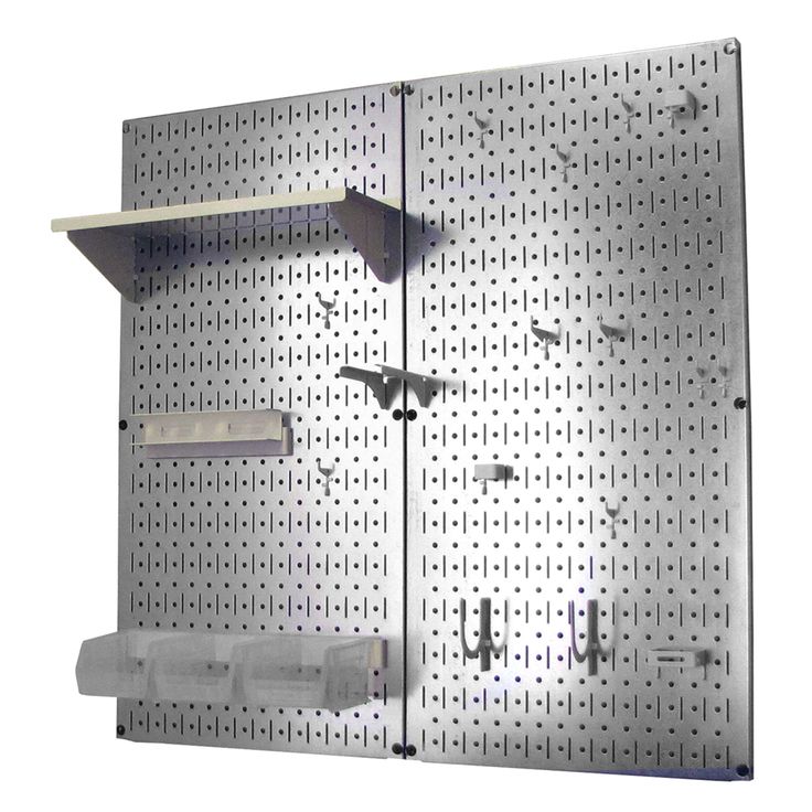 a metal pegboard with hooks and shelves on it