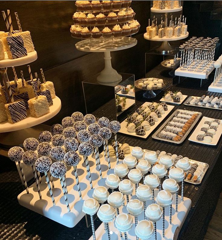 a table filled with lots of different types of desserts