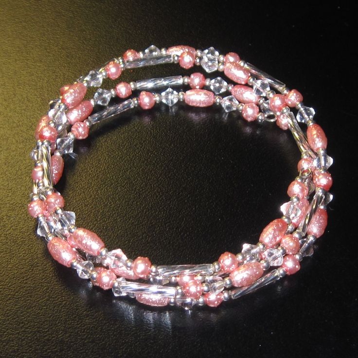 Memory Wire Bracelet With Light Coral/Peach Faux Freshwater Pearls, Silver Bugle/Seed Beads And Clear Faceted Bicone Accents. One Bracelet, 4 Loops. Should Fit A 6.5-8.5 Inch Wrist, But Will Fit Larger If You Don't Mind Your Bracelets Close-Fitting. Brand New, Never Worn Nwt. Handmade By Me, The Sparkliefiend! Memory Wire Is A Steel Wire That "Remembers" Its Shape. Items Made With This Material Do Not Require A Clasp. Trendy Jewelry Ideas, Memory Wire Jewelry, Memory Wire Wrap Bracelets, Jeans Ideas, Beaded Stuff, Wire Jewelery, Beaded Memory Wire Bracelets, Beading Inspiration, Lovers Bracelet