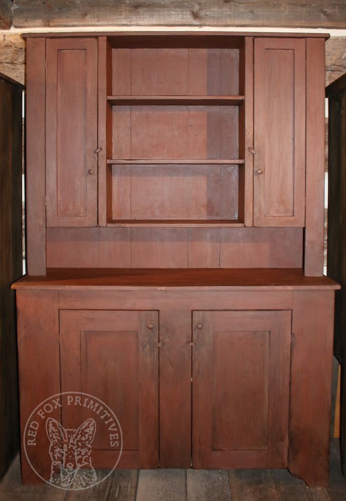 an old wooden hutch with cupboards and shelves