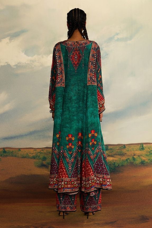 Teal green panelled A-line kurta with all over tribal print and button front. - Aza Fashions Bohemian Long Designer Dresses, Long Bohemian Designer Dresses, Bohemian Long Sleeve Designer Dress, Traditional Green Maxi Kurta, Bohemian Maxi Kurta With Dupatta, Bohemian Maxi Length Kurta With Dupatta, Bohemian Maxi Length Kurta For Transitional Season, Green Bohemian Designer Dress, Designer Wear Bohemian Kurta In Maxi Length