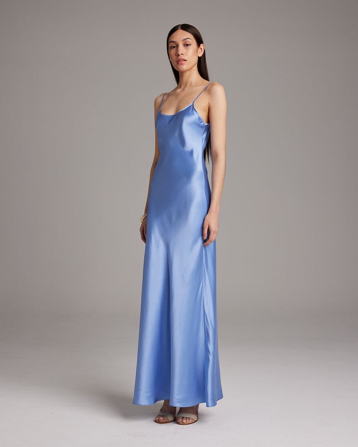 Named by Vogue as a must-have, this easy to wear luxury charmeuse slip dress is the perfect day to night staple. Featuring a bias cut and the finest silk quality, it shapes flatteringly to every type of body. Bias cut silk charmeuse slip elegantly drapes on the body. 100% Silk Charmeuse Made in New York City Model is wearing a size S and is 5'10" Product Care: Dry Clean Only Blue Slip Dress, City Model, The Perfect Day, Silk Slip Dress, Boatneck Sweater, Silk Tank, Silk Slip, Silk Charmeuse, Vintage Glamour