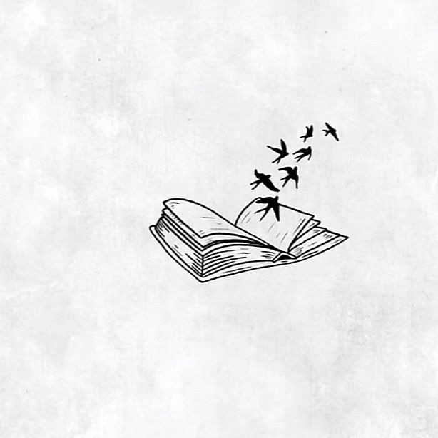 an open book with birds flying over it