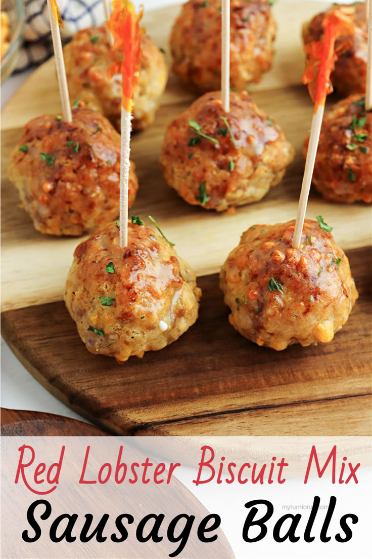 red lobster biscuit mix sausage balls with toothpicks in them on a cutting board