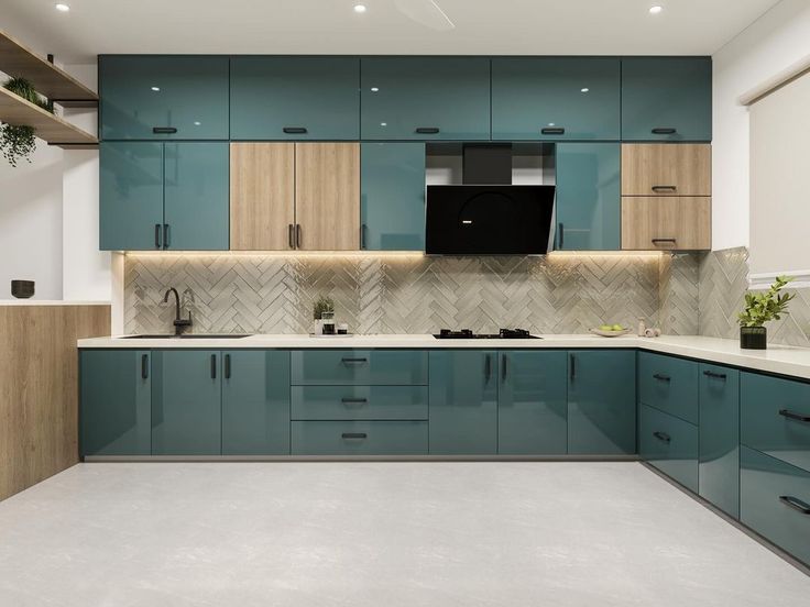 a large kitchen with blue cabinets and white counter tops is seen in this image from the front view