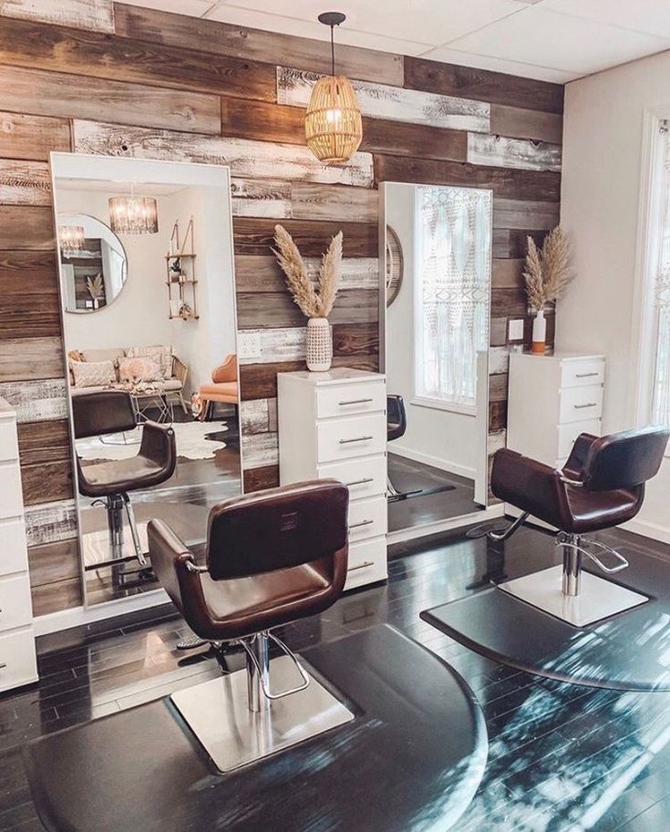 a hair salon with chairs and mirrors