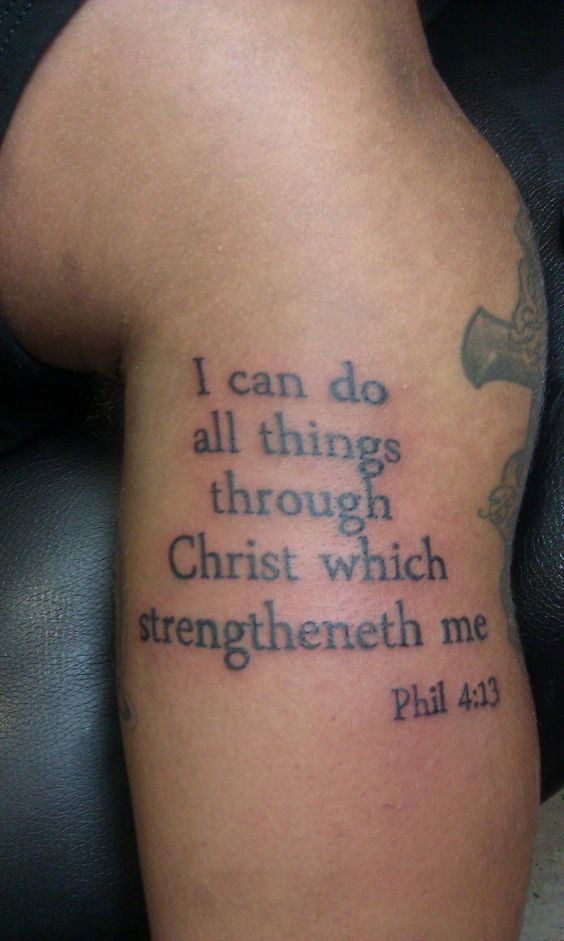 a person with a tattoo saying i can do all things through christ which straighten me