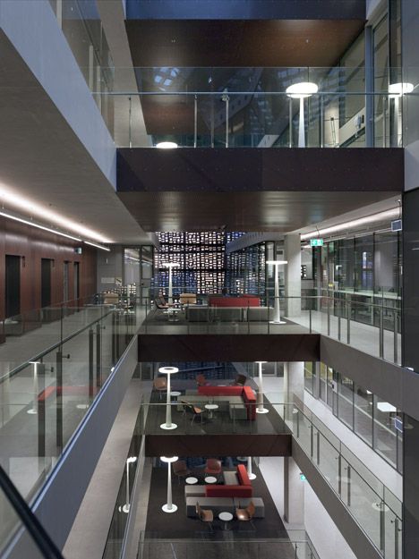 the inside of a building with glass balconies