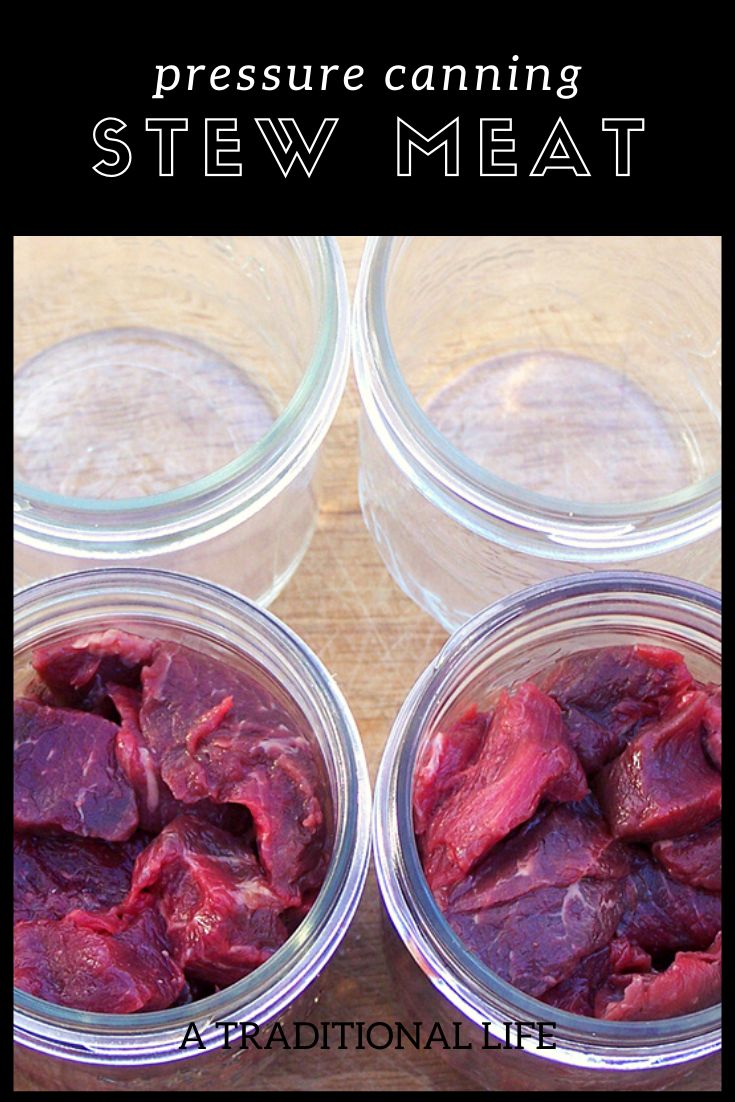 three jars filled with raw meat sitting on top of a wooden table next to each other