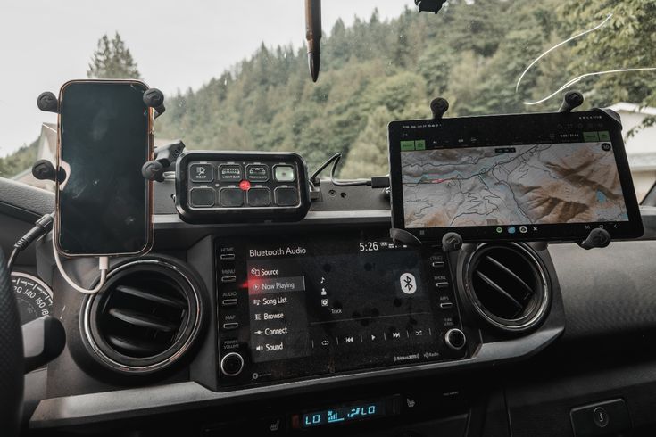 the dashboard of a vehicle with gps and other electronic devices