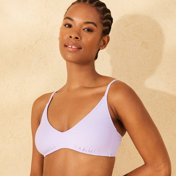 Scoop-front bikini top from Wild Fable™ in a solid hue. Soft and stretchy fabric with full lining and adjustable straps offers all-day comfort in and out of the water. Removable cups provide customizable coverage. If you're not satisfied with any Target Owned Brand item, return it within one year with a receipt for an exchange or a refund. Wild Fable™: A look for every story. Solid Color Bra With Padded Cups For Poolside, Poolside Bra With Padded Cups, Seamless Full Coverage Swimwear For Sunbathing, Seamless Full Coverage Swimwear For Vacation, Solid Color Swimwear With Padded Cups For Vacation, Summer Full Coverage Swim Bra, Triangle Top Sports Bra With Adjustable Straps For Poolside, Triangle Top Sports Bra With Adjustable Straps, Summer Beachwear Solid Sports Bra