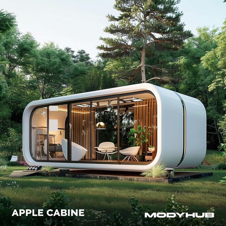 an apple cabin is shown in the middle of some trees and grass with chairs around it