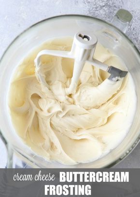 a blender filled with white batter on top of a table