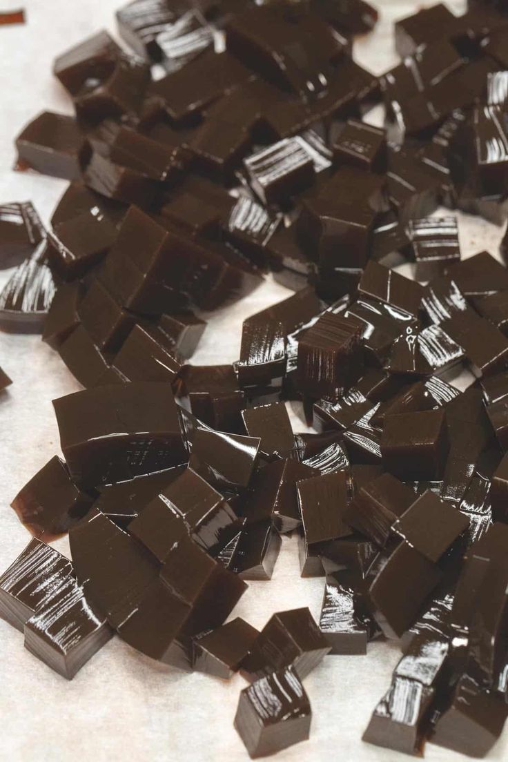 a pile of chocolate pieces sitting on top of a table