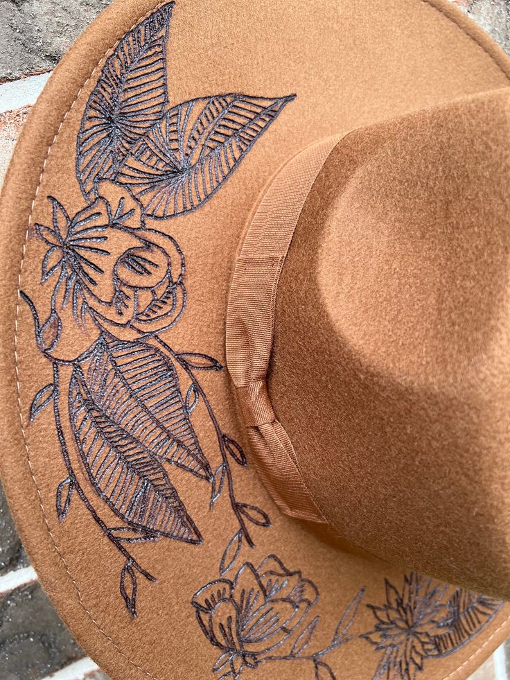 Celebrate your inner country girl with this unique Custom Rancher Hat. Hand burned flowers give it an eye-catching flair, perfect for a fashion-forward look. Show off your brown-eyed girl style in this one-of-a-kind hat. hand burned hat with floral details Western Style Brown Hat For Spring, Brown Fedora One Size Fits Most, Spring Beach Brown Felt Hat, Brown Felt Hat For Rodeo In Spring, Brown Felt Hat For Spring Rodeo, Brown Felt Hat For Spring Country Events, Vintage Brown Fedora For Spring, Brown Vintage Fedora For Spring, Spring Rodeo Brown Felt Hat